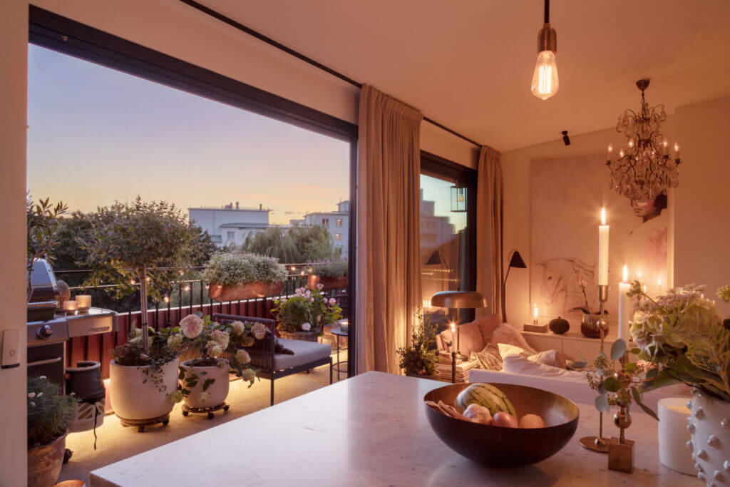 A Small Attic Apartment with Plenty of Storage 9 kitchen-living-small-attic-apartment-balcony-evening-light-nordroom