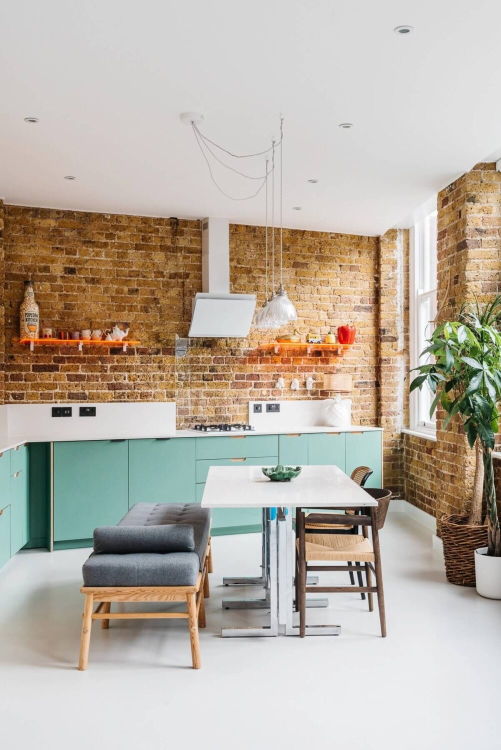31 Practical Kitchen Flooring Ideas For Your Home 31 kitchen-pale-green-cabinets-exposed-brick-walls-warehouse-apartment-london-nordroom