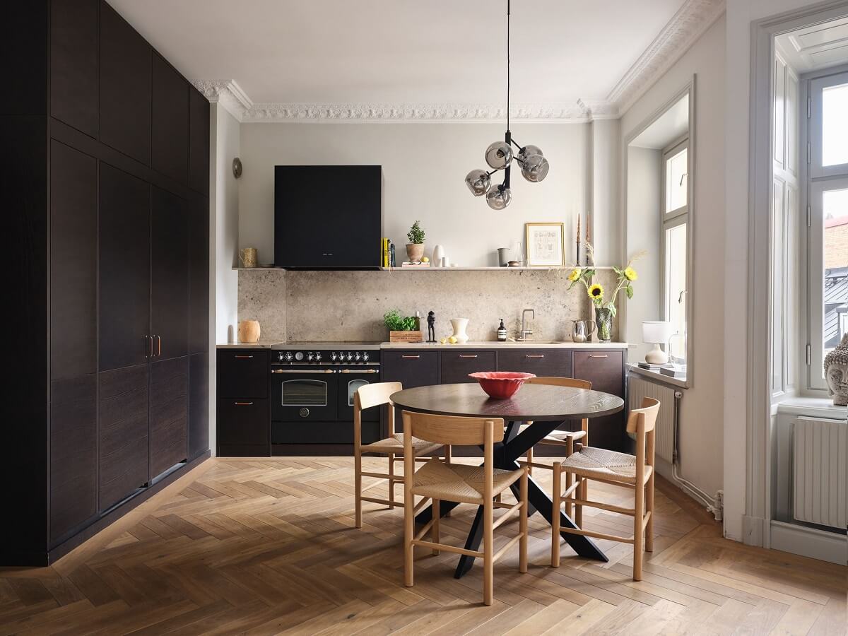 A Stylish Nordic Apartment with Attic Bedroom 8 kitchen-round-dining-table-floor-to-ceiling-cabinets-nordroom