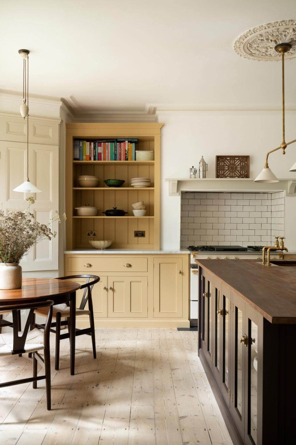 57 Stylish Two-Tone Kitchen Cabinet Ideas 31 kitchen-round-dining-table-island-yellow-cabinets-open-shelves-nordroom