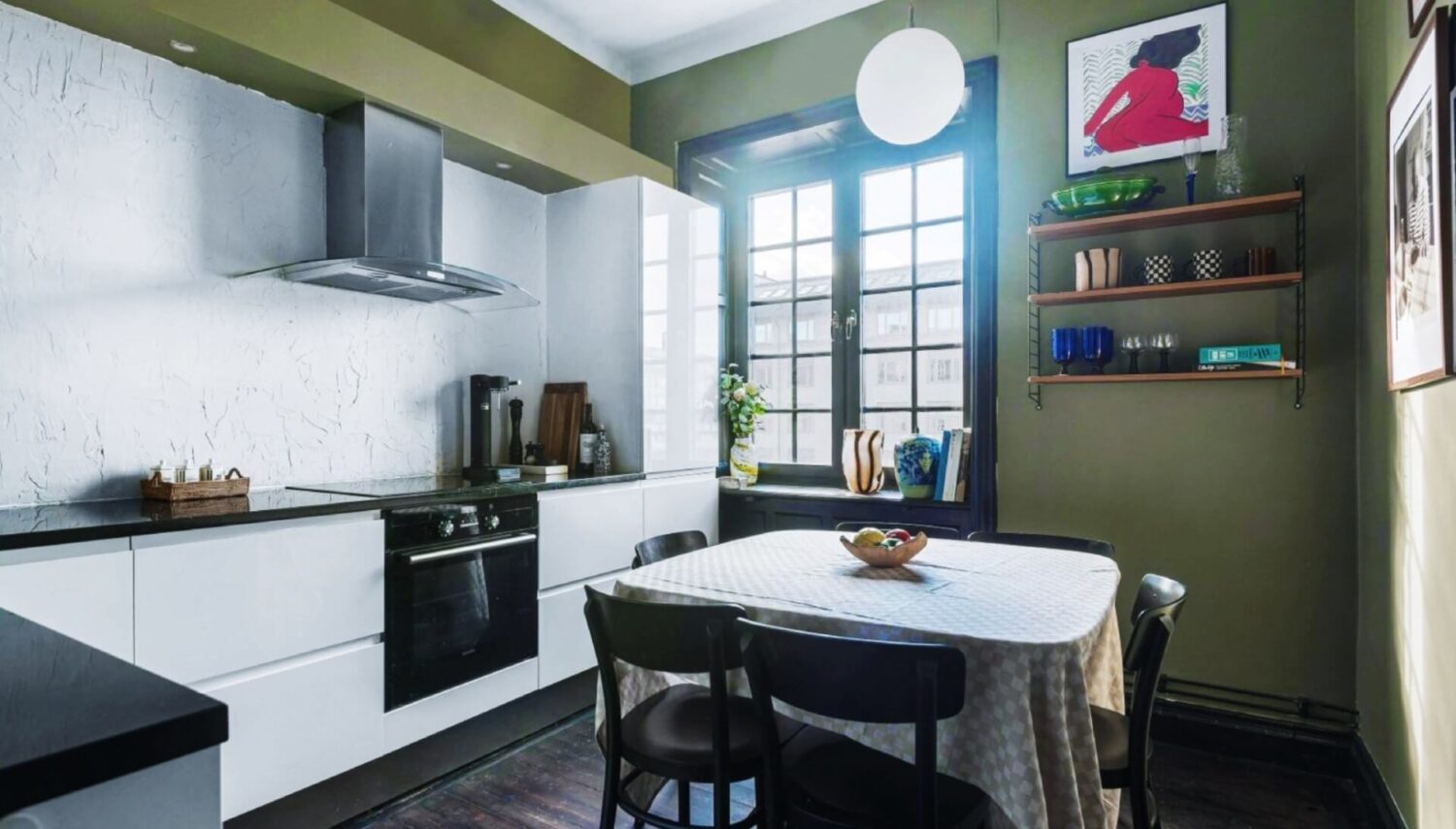 A Colorful Nordic Apartment with Dusty Pink Walls 15 kitchen-white-cabinets-green-walls-nordroom