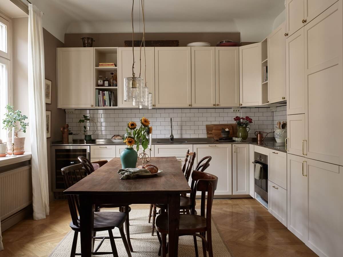 A Warm Nordic Apartment with Light Brown Walls 10 l-shaped-kitchen-dining-table-nordroom