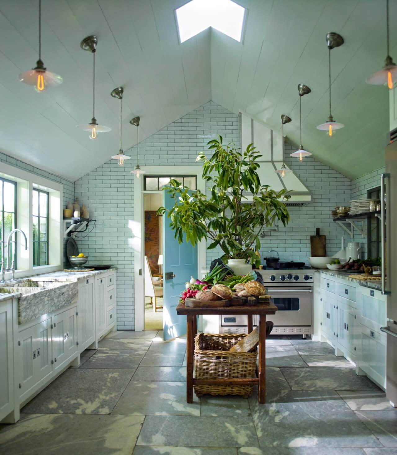 Beautiful Kitchens with Skylights That Add Light and Style 9 large-country-kitchen-stone-floor-small-skylight-island-nordroom