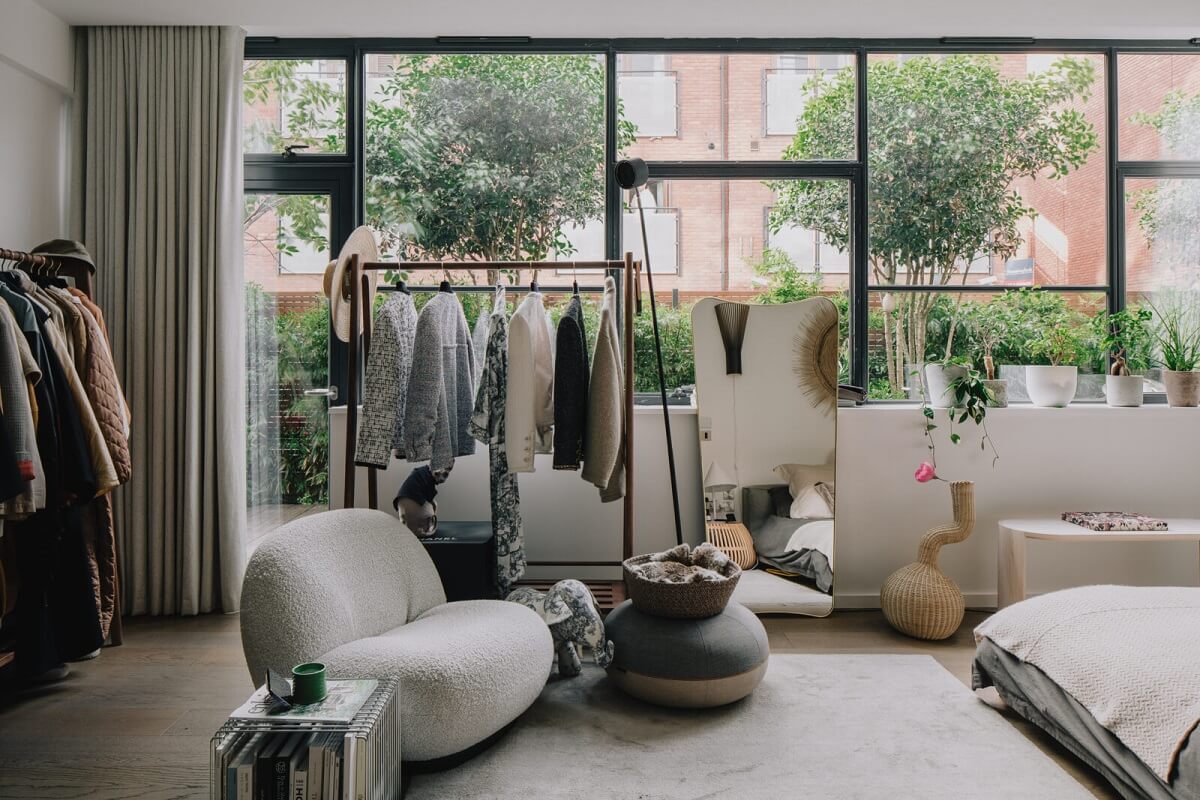 A Modern Apartment in a Former Warehouse in London 10 large-windows-bedroom-open-clothing-racks-gubi-chair-nordroom