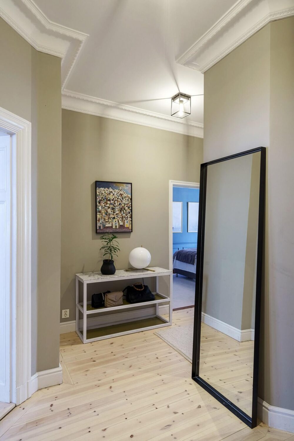 A Classic Nordic Apartment Decorated with Modern Furnishings and Color 19 light-gray-hallway-large-mirror-nordroom