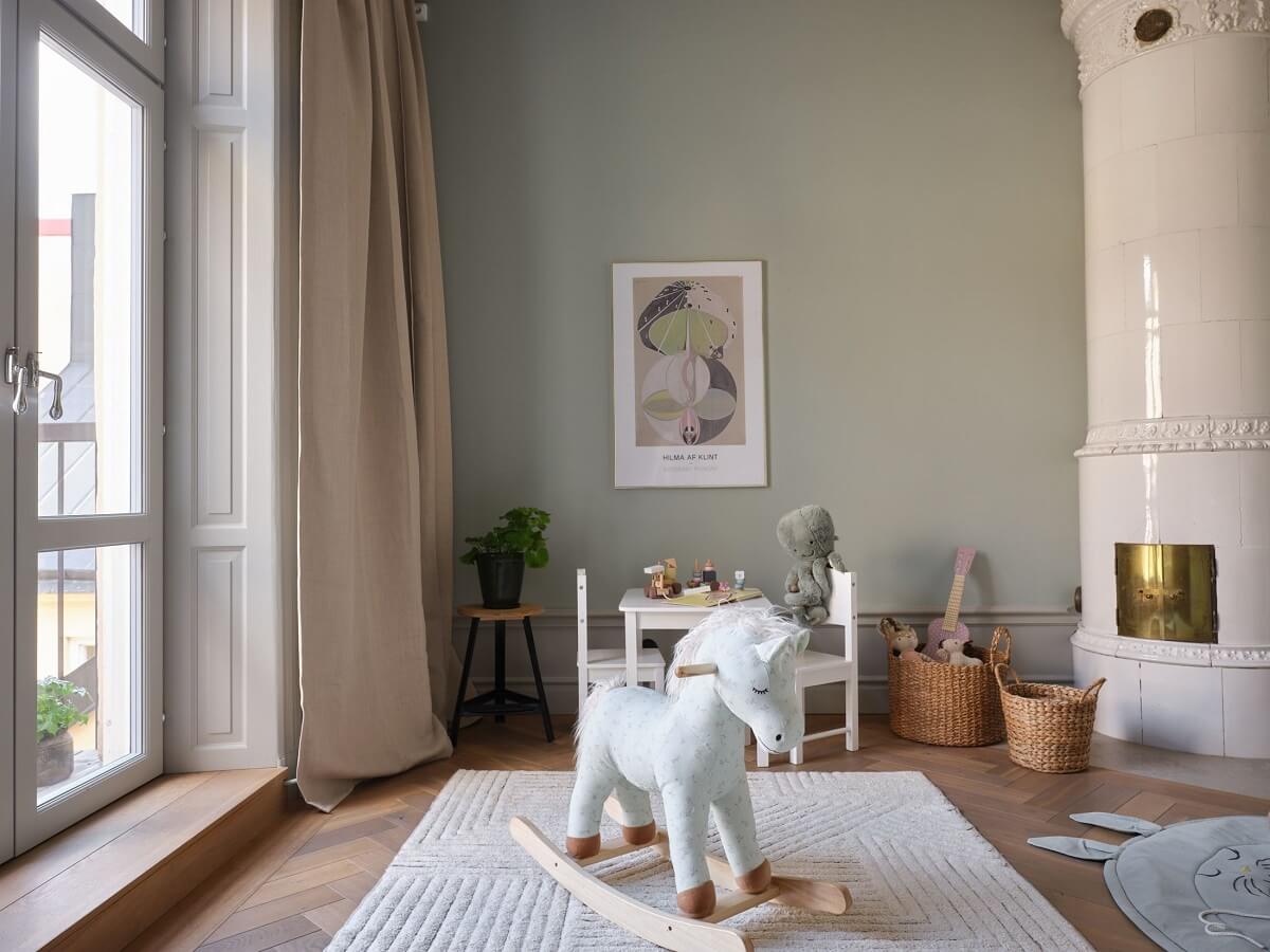 A Stylish Nordic Apartment with Attic Bedroom 14 light-gray-nursery-kakelugh-tiled-fireplace-nordroom