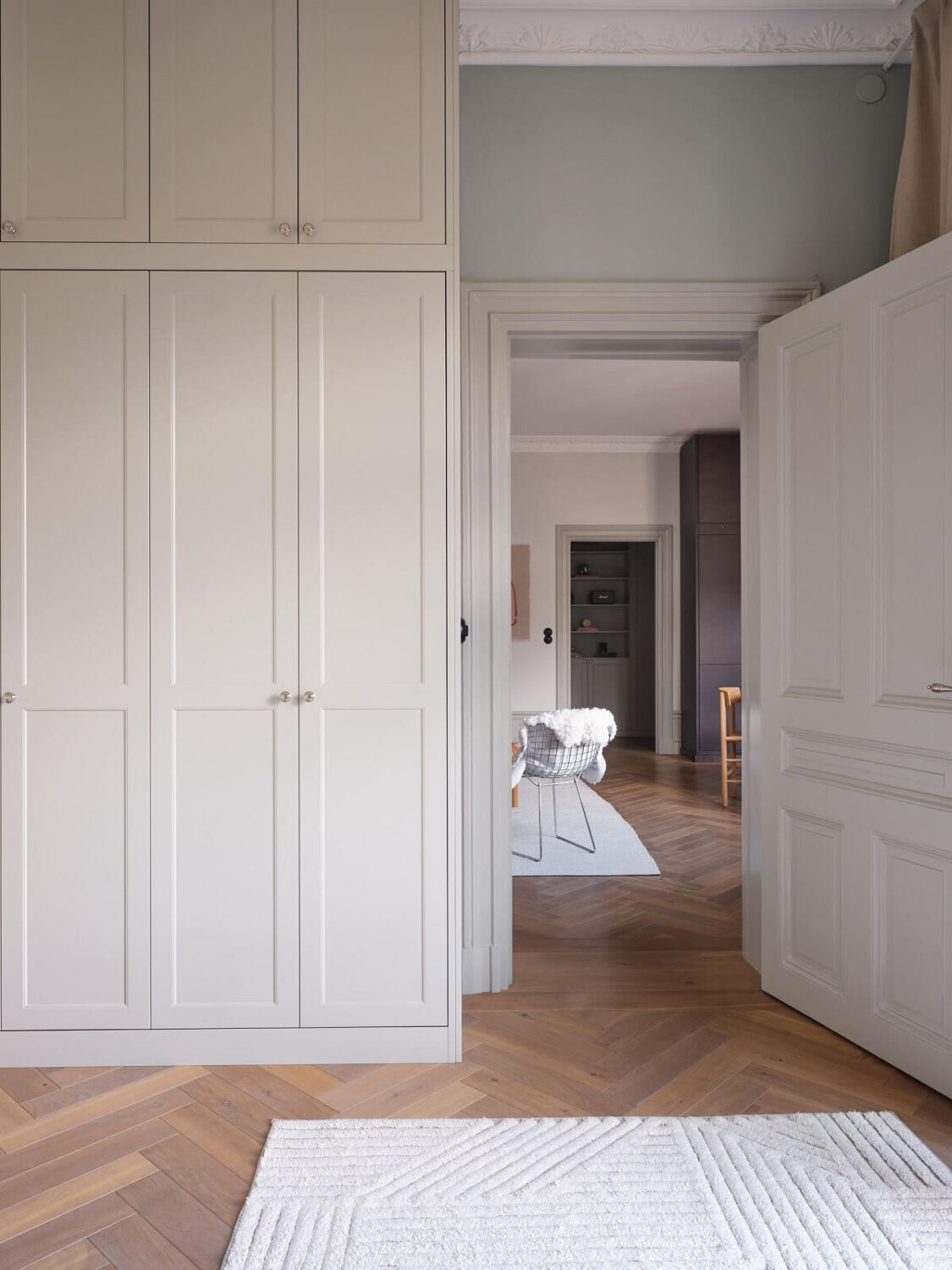 A Stylish Nordic Apartment with Attic Bedroom 16 light-gray-room-floor-to-ceiling-wardrobes-nordroom