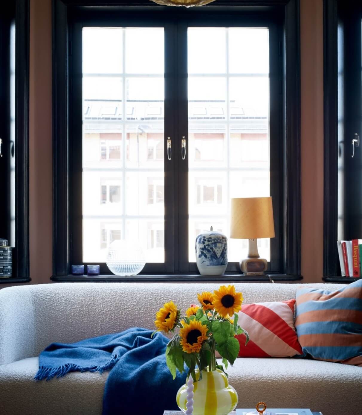 A Colorful Nordic Apartment with Dusty Pink Walls 6 living-room-detail-colorful-decor-nordroom