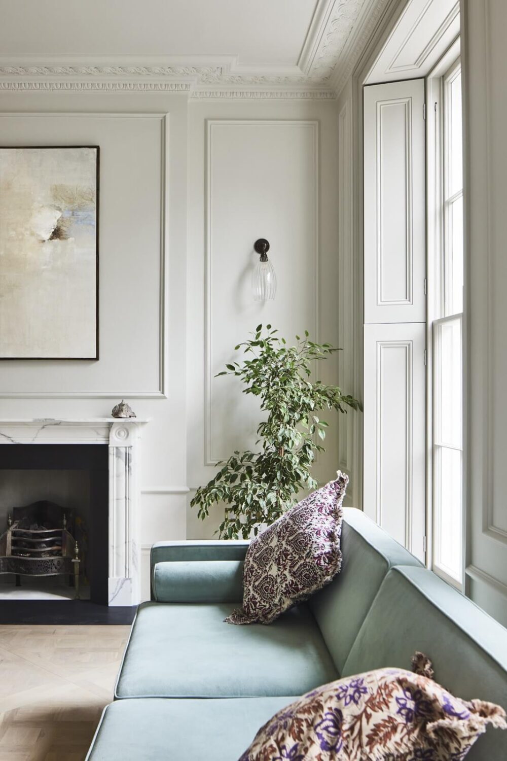 Valspar Color of the Year 2024: Renew Blue 16 living-room-fireplace-plaster-work-light-blue-sofa