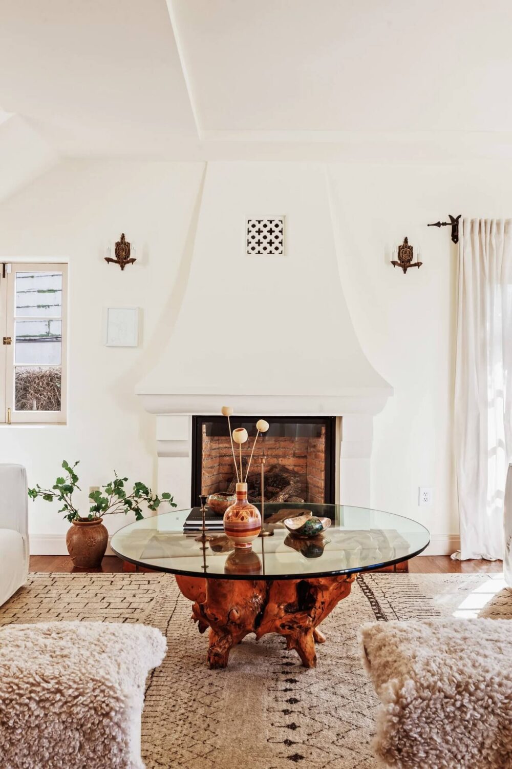 A Bright Spanish-Style Villa in Los Angeles 4 living-room-fireplace-round-coffee-table-white-walls-nordroom