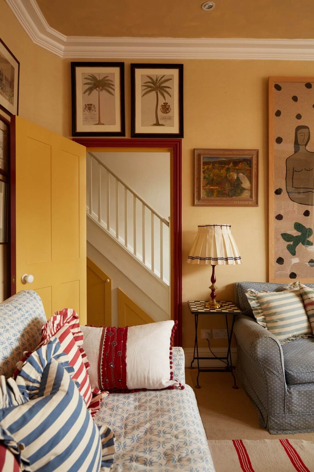 A Colorful Eclectic House Designed by Alice Palmer 12 living-room-yellow-walls-red-accents-nordroom