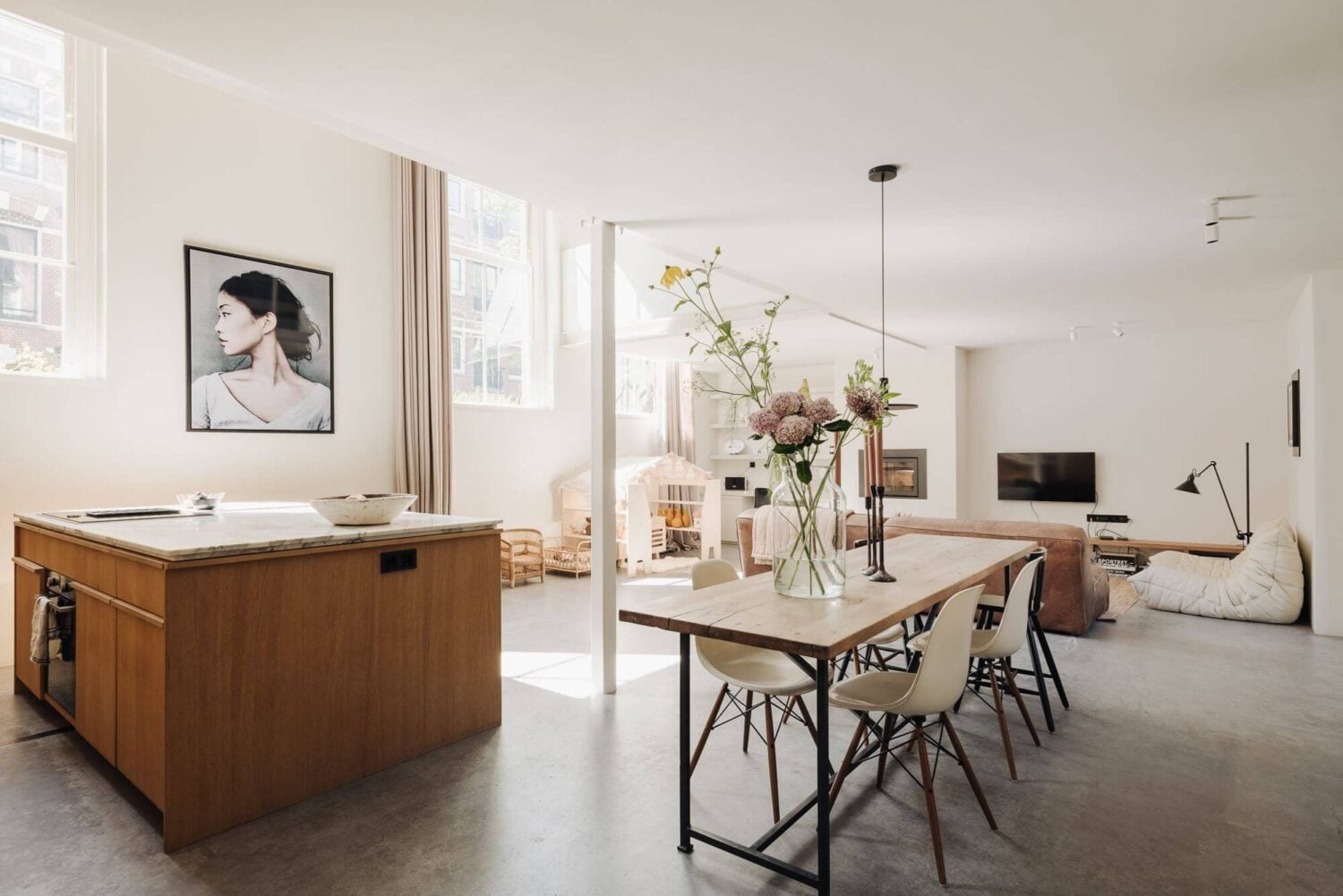 A Modern Family Loft in a Former School Building 6 loft-concrete-floor-kitchen-dining-space-high-ceilings-nordroom