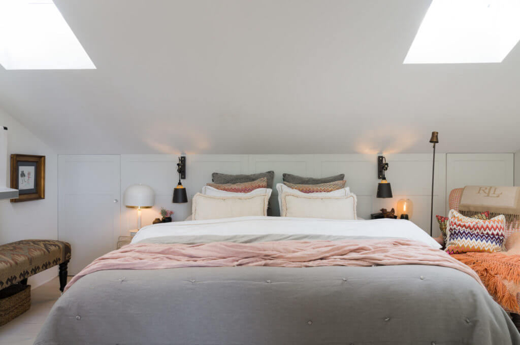 A Small Attic Apartment with Plenty of Storage 11 master-bedroom-skylights-sloped-ceiling-nordroom