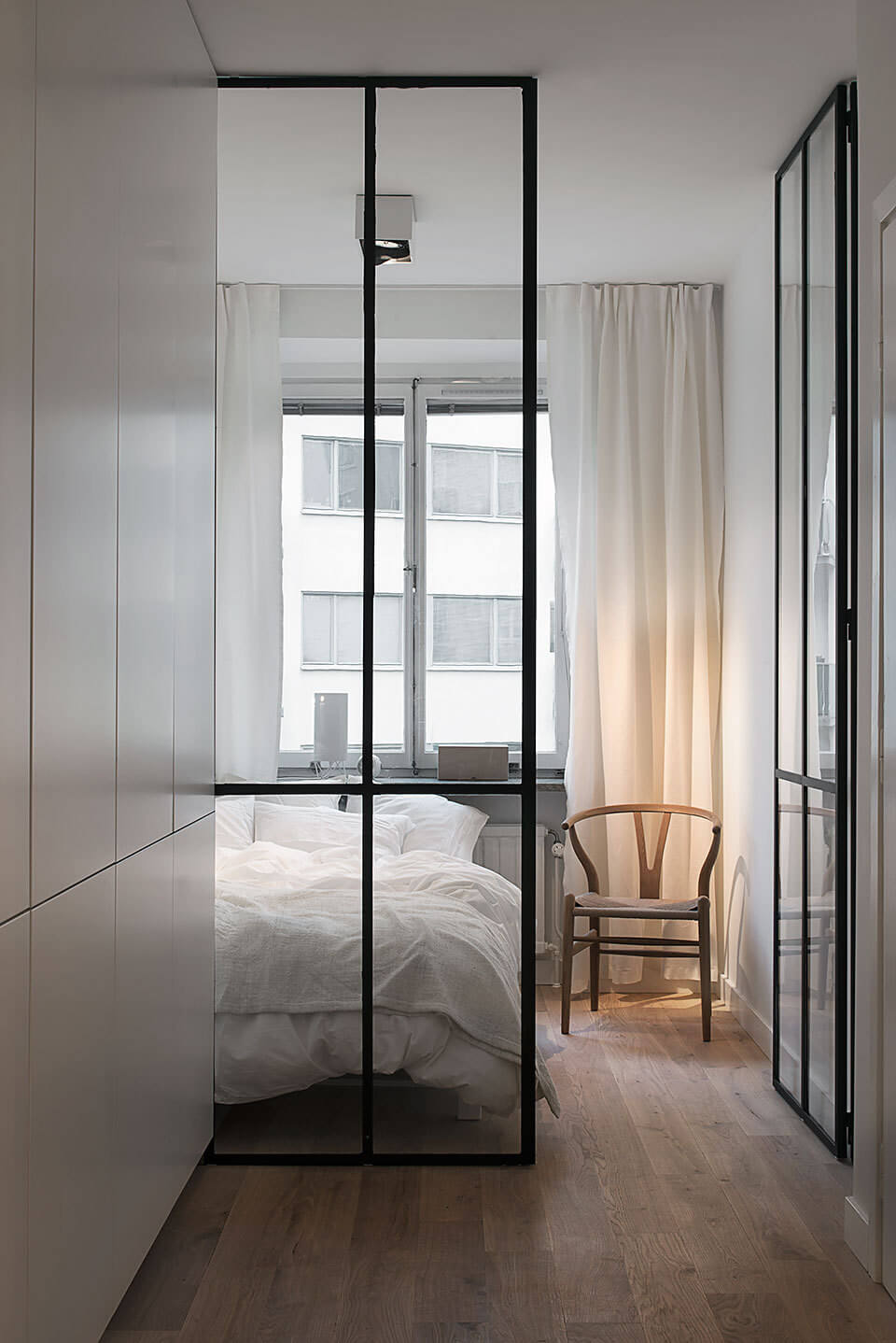 Great Living Room Bedroom Combo Ideas (Layout Tips + Styling) 17 minimalistic-glass-steel-room-didivder-nordroom