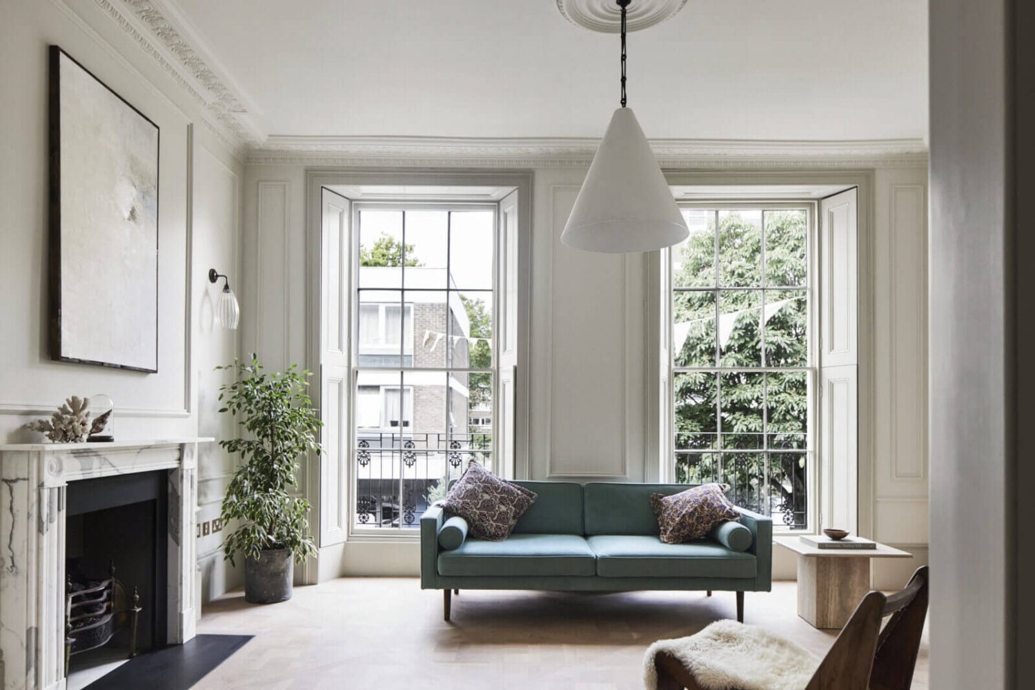 A Stylish Regency Townhouse in London 9 minimalistic-living-room-light-blue-sofa-fireplace-stucco-nordroom