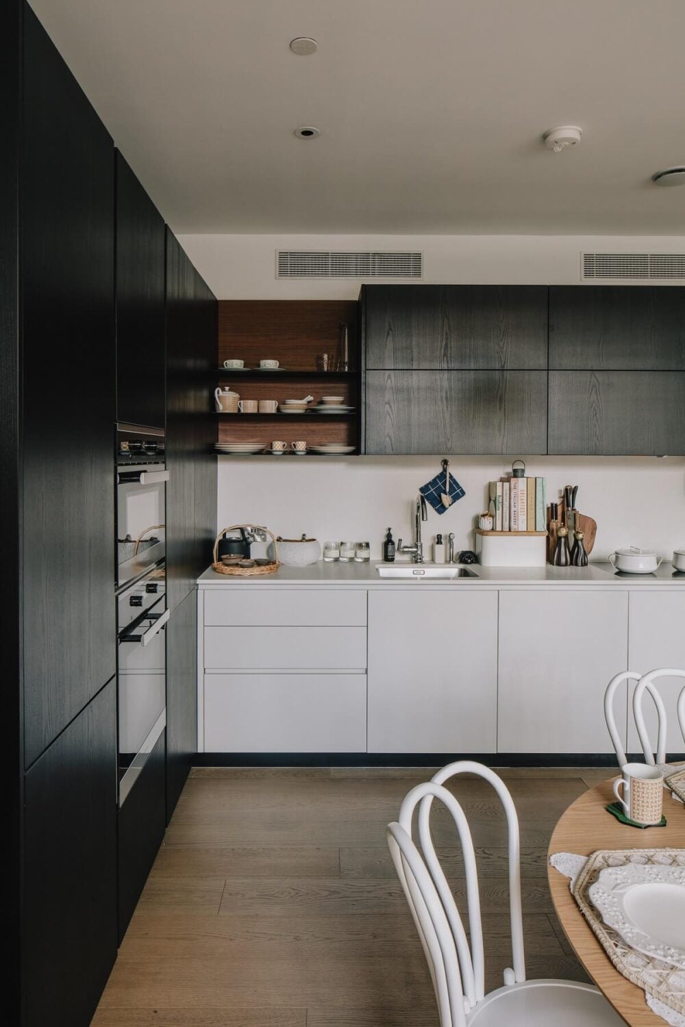 A Modern Apartment in a Former Warehouse in London 7 modern-kitchen-black-white-cabinets-open-shelves-nordroom