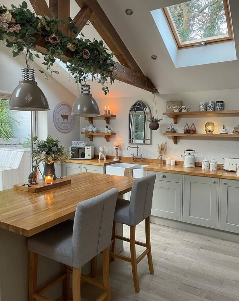 Beautiful Kitchens with Skylights That Add Light and Style 27 modern-kitchen-breakfast-bar-open-shelves-exposed-wooden-beams-skylight-nordroom