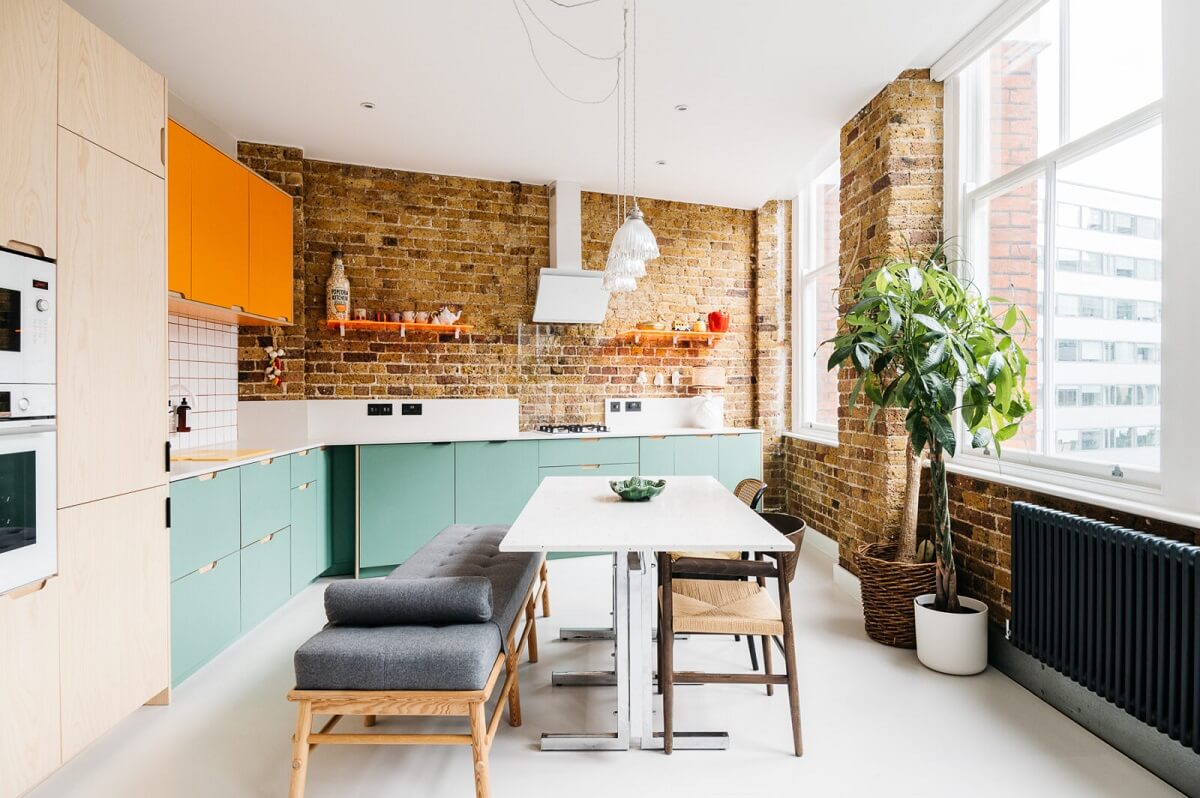 57 Stylish Two-Tone Kitchen Cabinet Ideas 51 modern-kitchen-pale-green-orange-cabinets-brick-walls-nordroom