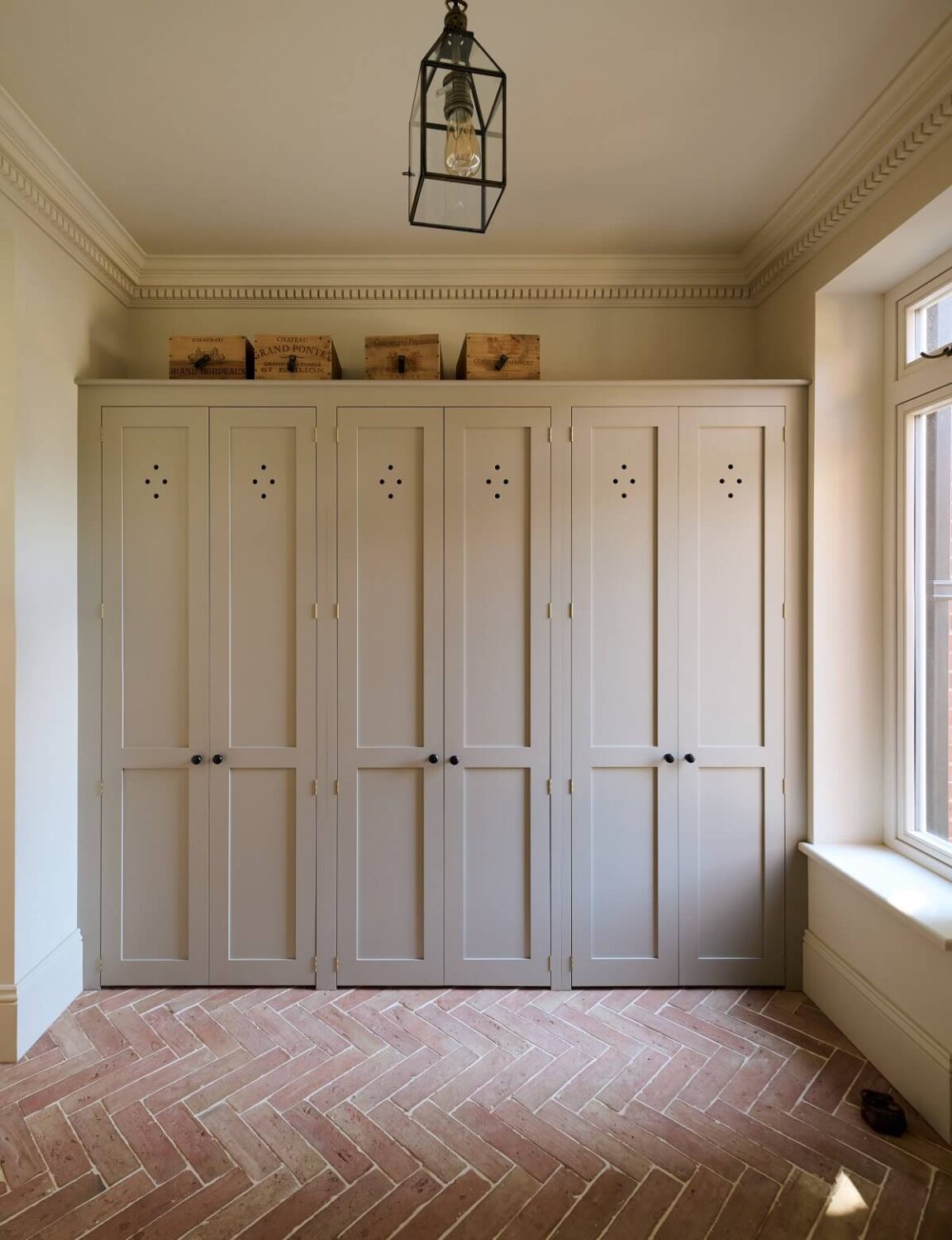 A Spacious Country Kitchen with Huge Skylight 15 mud-room-built-in-cabinets-stone-floor-nordroom