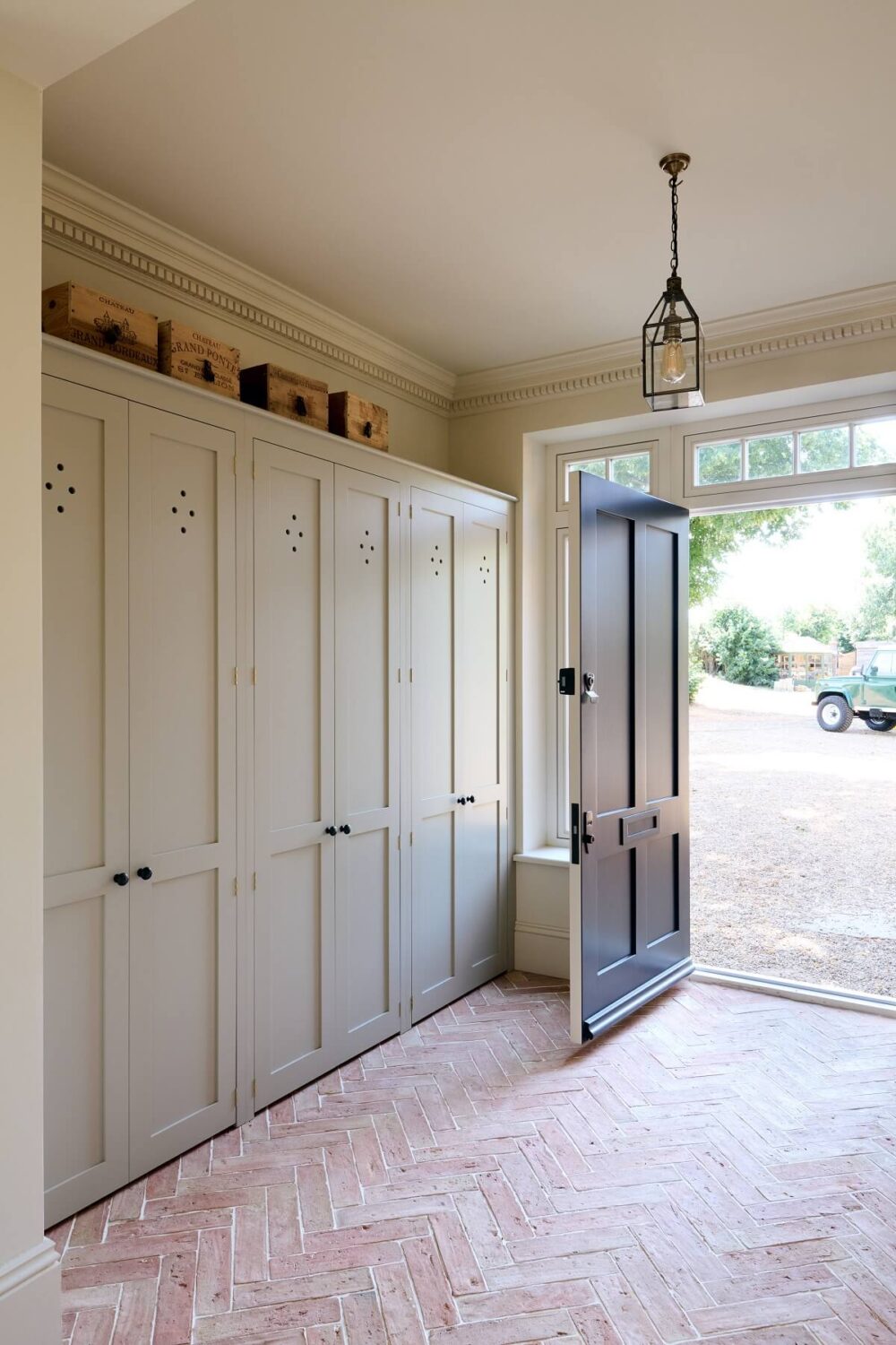 A Spacious Country Kitchen with Huge Skylight 16 mud-room-shaker-cabinets-devol-stone-floor-farmhouse-nordroom