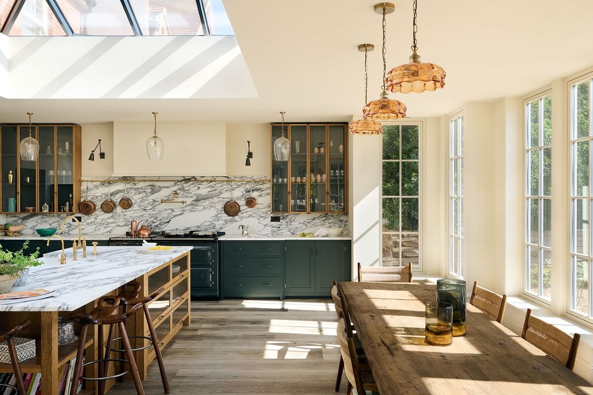 A Spacious Country Kitchen with Huge Skylight 2 open-plan-kitchen-dining-room-haberdasher-island-shaker-green-cabinets-nordroom