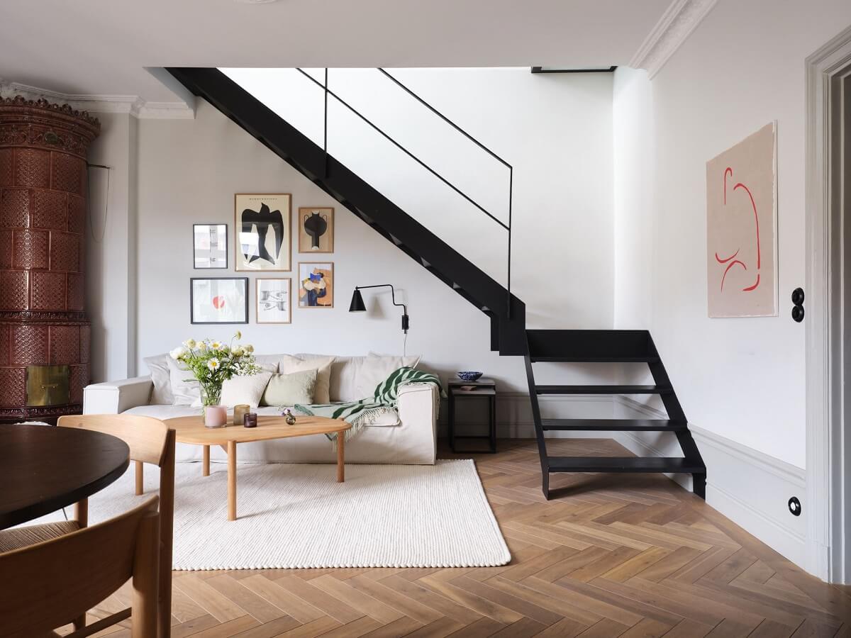 A Stylish Nordic Apartment with Attic Bedroom 3 open-plan-living-room-black-staircase-nordroom
