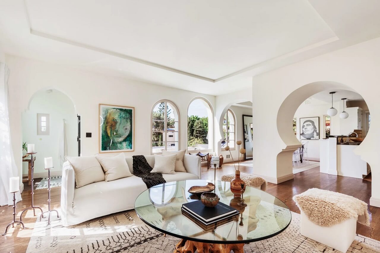 A Bright Spanish-Style Villa in Los Angeles 6 open-plan-living-room-white-walls-furniture-sculptural-doorway-spanish-style-home-nordroom