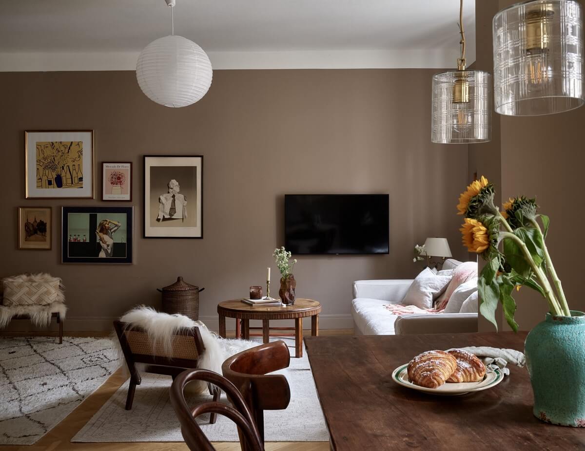 A Warm Nordic Apartment with Light Brown Walls 4 open-plan-living-room-wooden-dining-table-brown-walls-nordroom