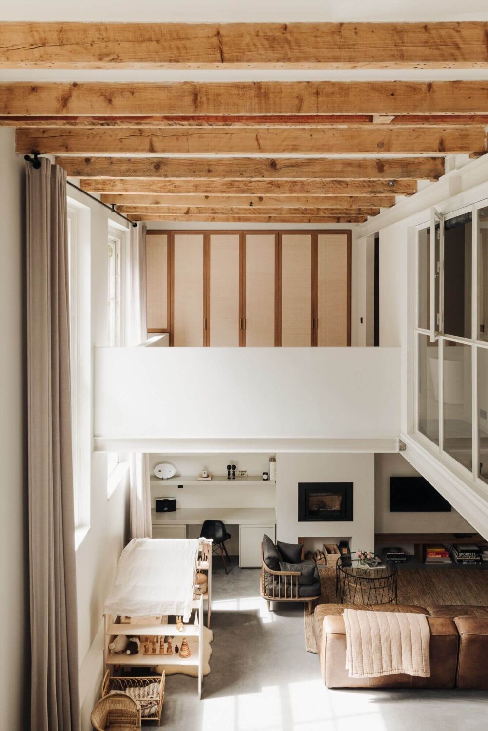 A Modern Family Loft in a Former School Building 9 open-plan-living-space-high-ceilings-exposed-wooden-beams-nordroom