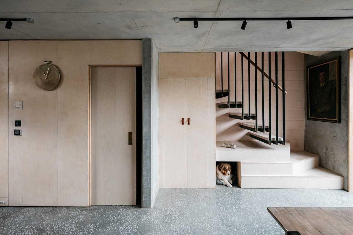 A Contemporary Version of a Victorian Terrace House 8 open-plan-living-space-steel-staircase-concrete-ceiling-nordroom
