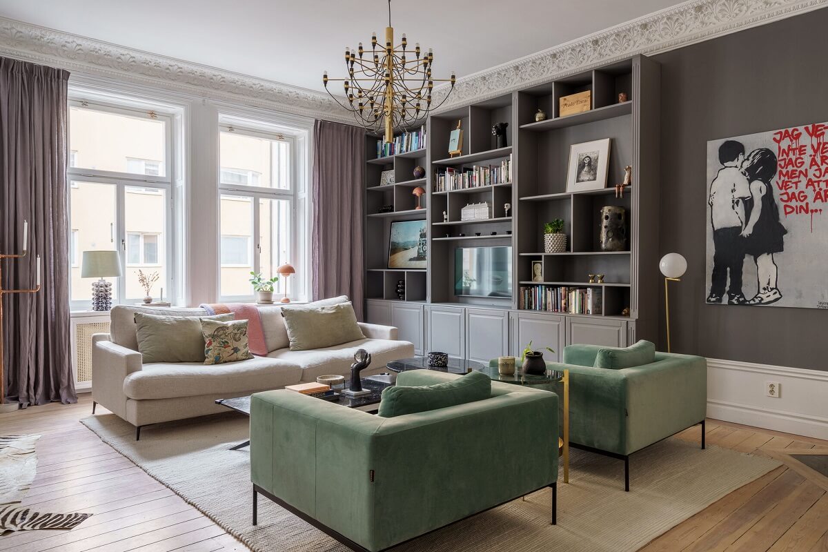 A Classic Nordic Apartment Decorated with Modern Furnishings and Color 2 scandnavian-living-room-gray-walls-green-armchairs-built-in-bookcases-nordroom