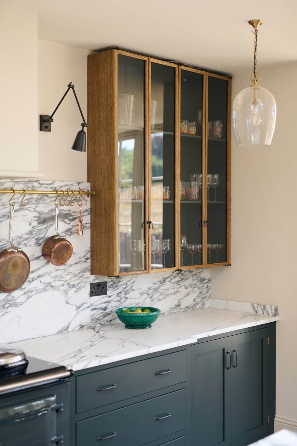A Spacious Country Kitchen with Huge Skylight 11 shaker-kitchen-green-cabinets-glass-upper-cabinet-devol-nordroom