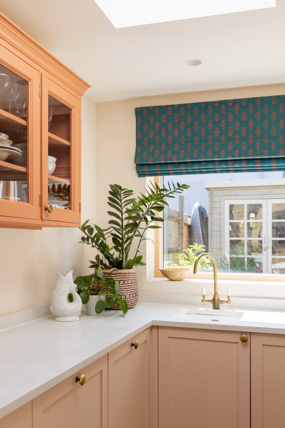 Beautiful Kitchens with Skylights That Add Light and Style 26 small-kitchen-orange-cabinet-skylight-blue-curtain-nordroom