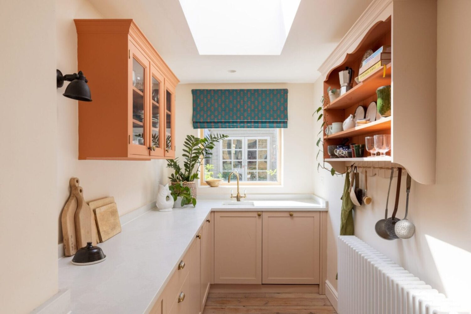 Beautiful Kitchens with Skylights That Add Light and Style 25 small-light-l-shaped-kitchen-orange-color-accents-nordroom