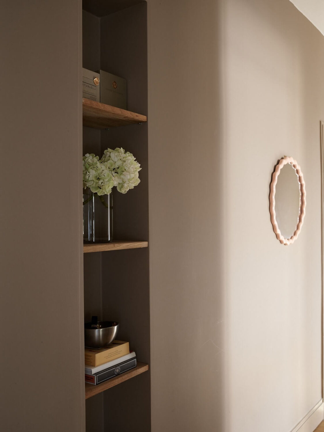 A Warm Nordic Apartment with Light Brown Walls 12 small-storage-niche-light-brown-walls-nordroom