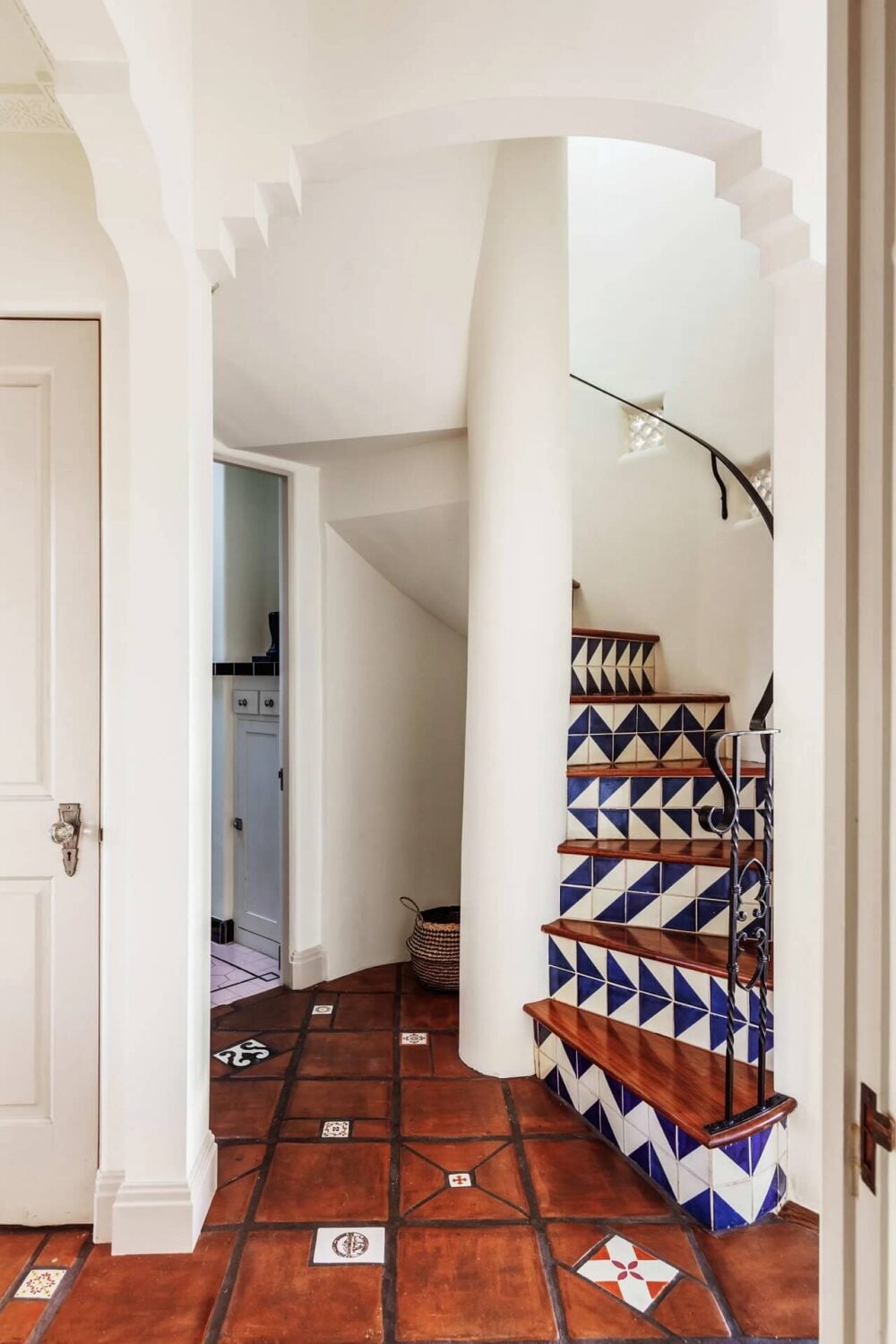 A Bright Spanish-Style Villa in Los Angeles 28 spiral-staircase-terracotta-tiles-colorful-stair-nordroom