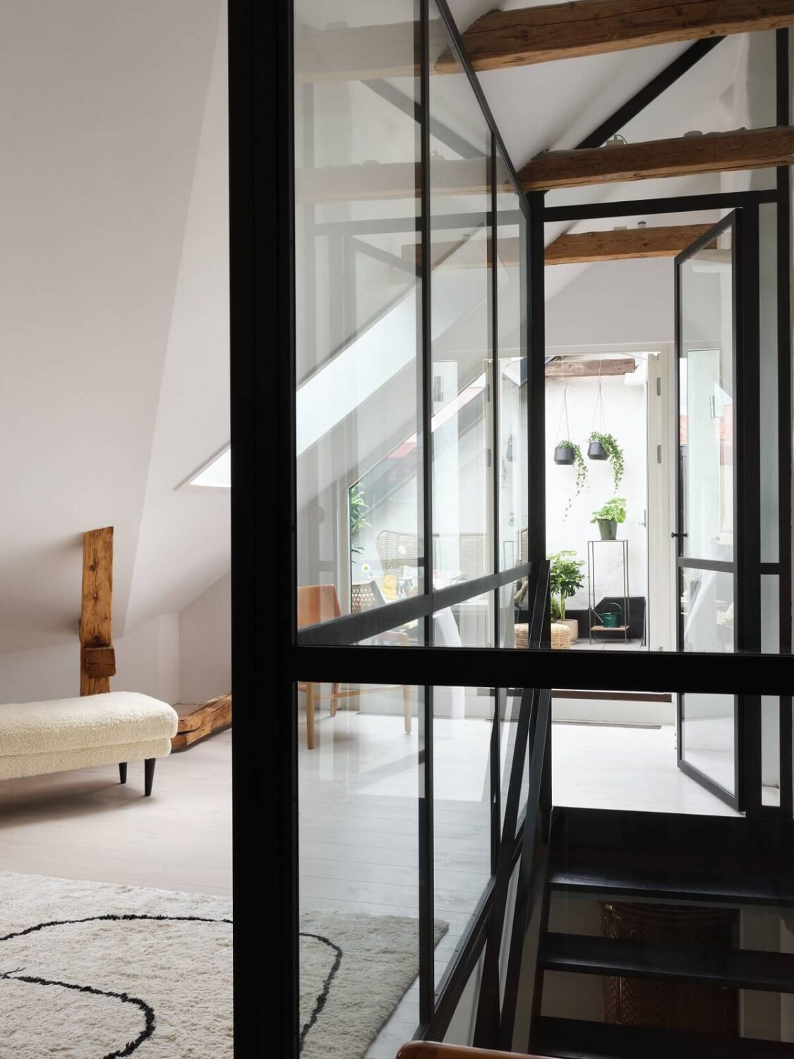 A Stylish Nordic Apartment with Attic Bedroom 22 steel-glass-wall-staircase-attic-bedroom-nordroom