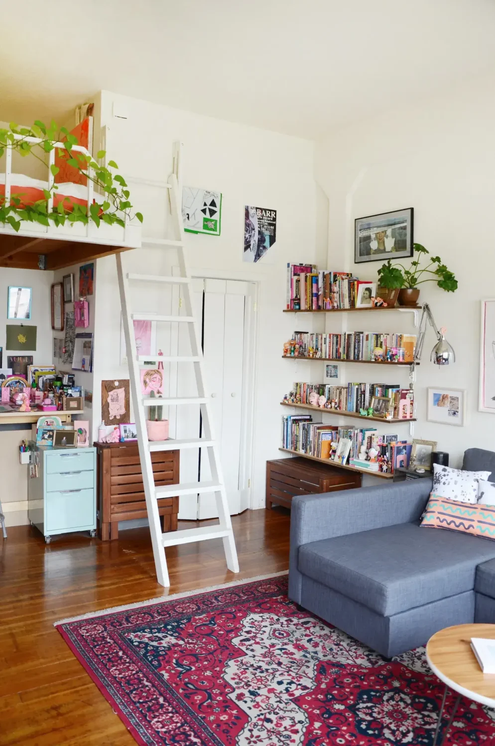 Great Living Room Bedroom Combo Ideas (Layout Tips + Styling) 11 studio apartment loft bed bookshelves Great Living Room Bedroom Combo Ideas (Layout Tips + Styling)