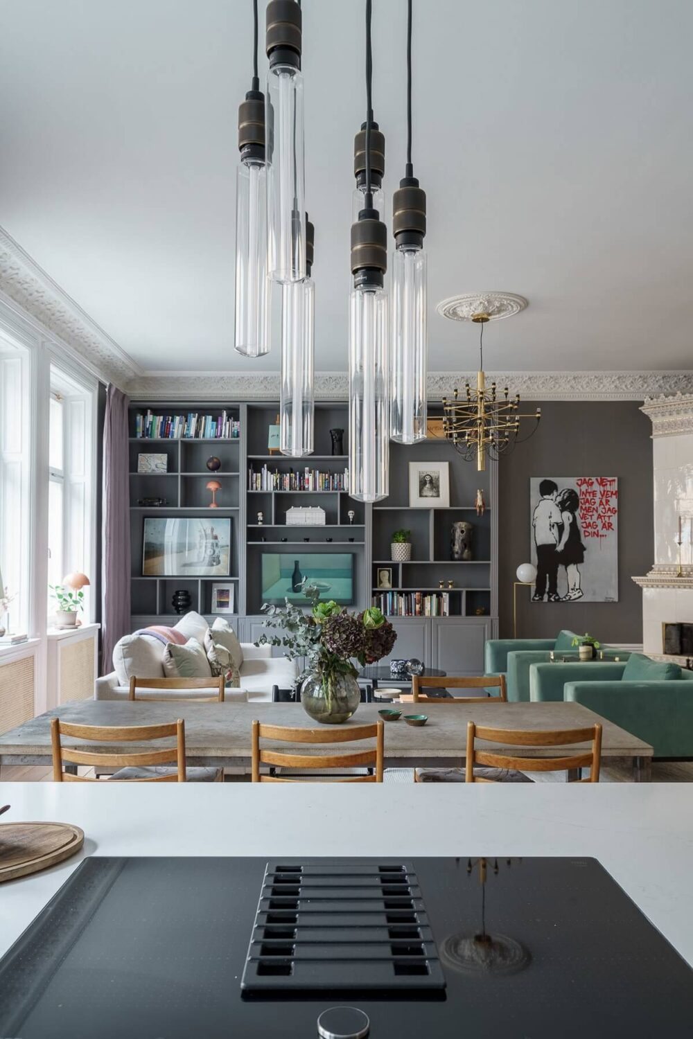 A Classic Nordic Apartment Decorated with Modern Furnishings and Color 8 view-from-the-kitchen-bookcases-nordroom