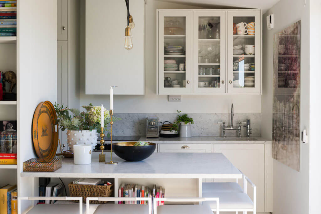 A Small Attic Apartment with Plenty of Storage 5 white-kitchen-breakfast-bar-small-attic-apartment-nordroom