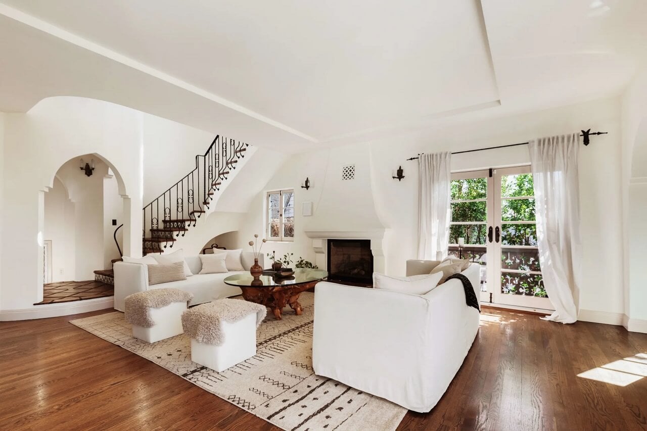 A Bright Spanish-Style Villa in Los Angeles 2 white-living-room-large-rug-staircase-nordroom