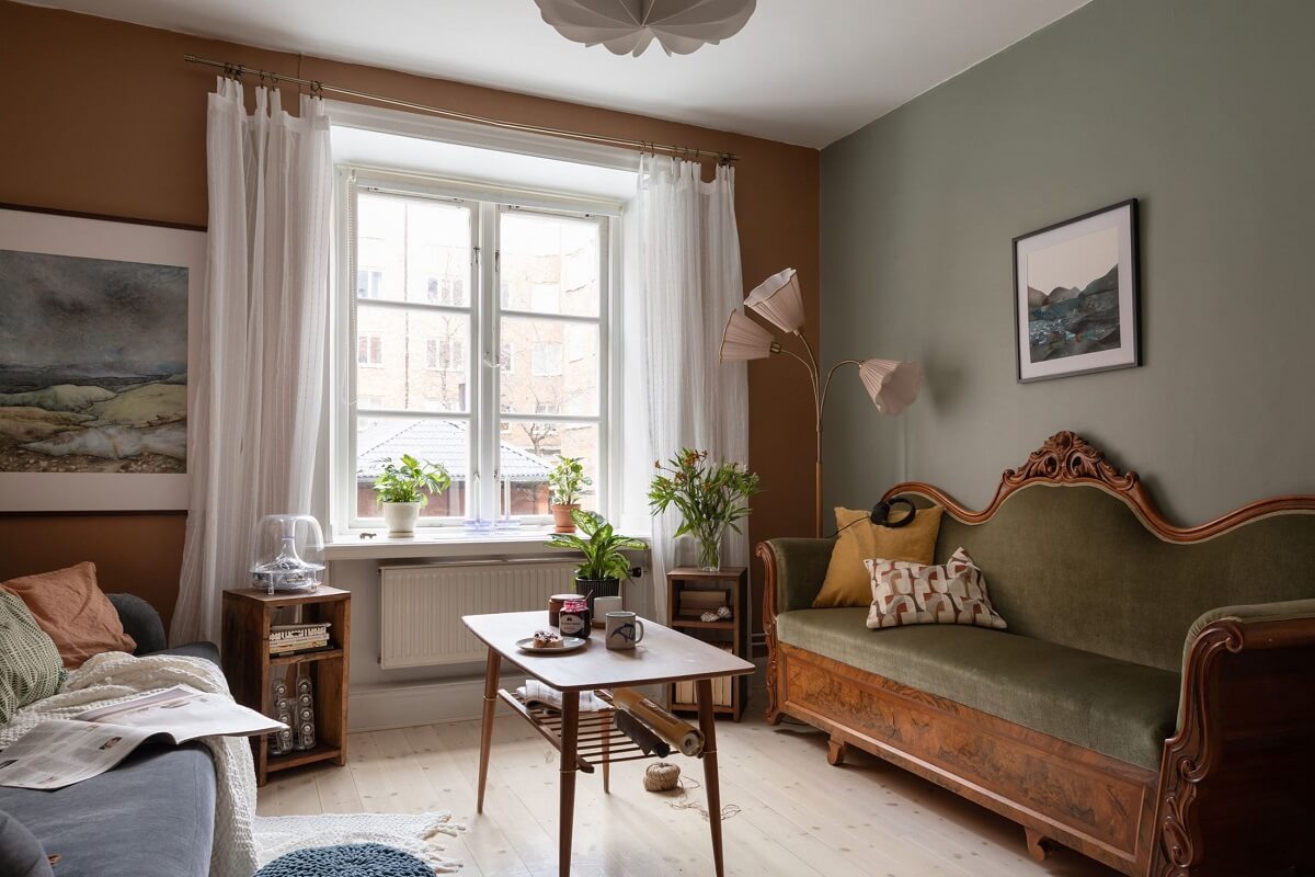 A Cozy Apartment Painted in Warm Natural Colors 3 antique-wooden-sofa-green-velvet-warm-sitting-room-nordroom