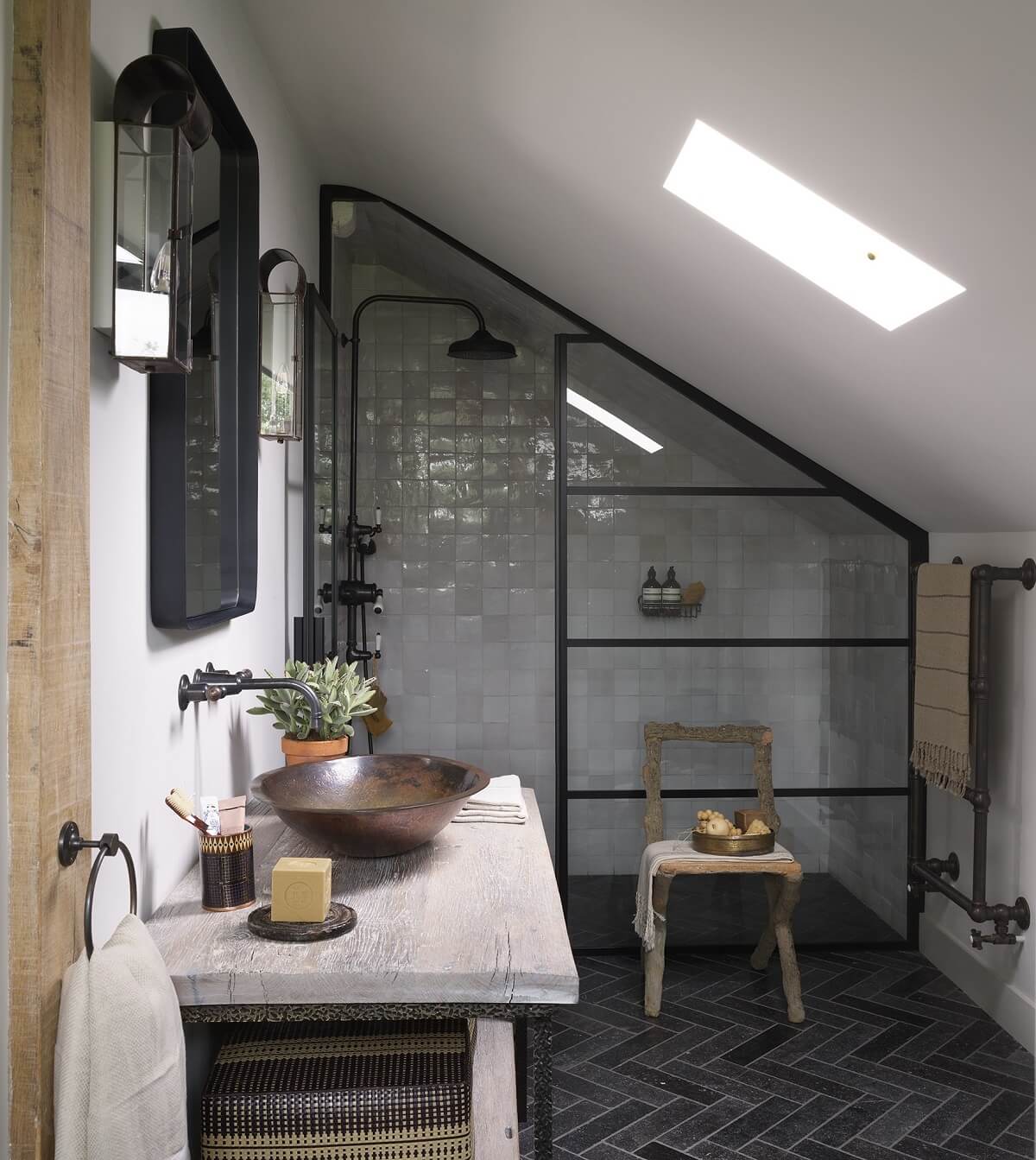 Herringbone vs. Chevron Flooring Patterns: Differences & Inspiration 19 attic bathroom with herringbone floor tiles and steel glass wall nordroom