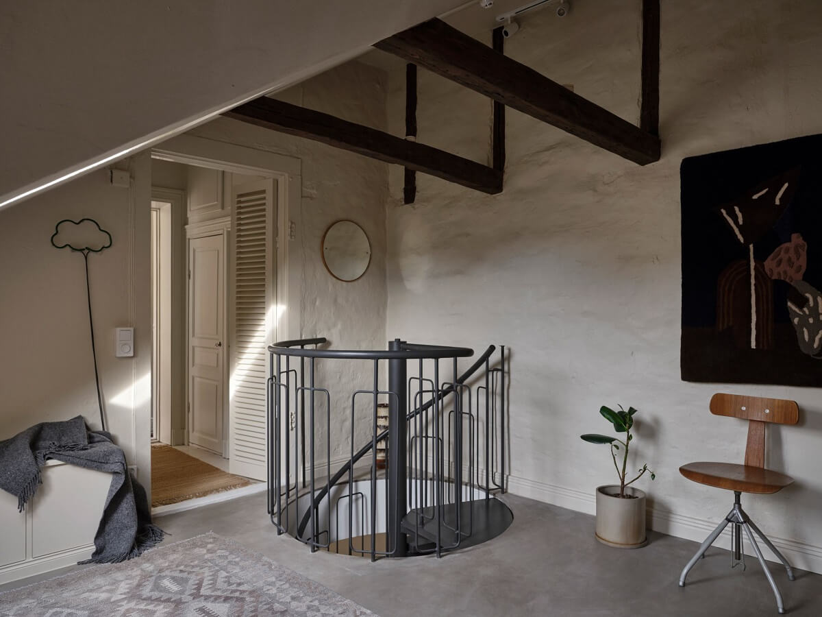 A Nordic Maisonette That Makes The Most Of Its Awkward Nooks 13 attic-room-exposed-wooden-beams-nordroom