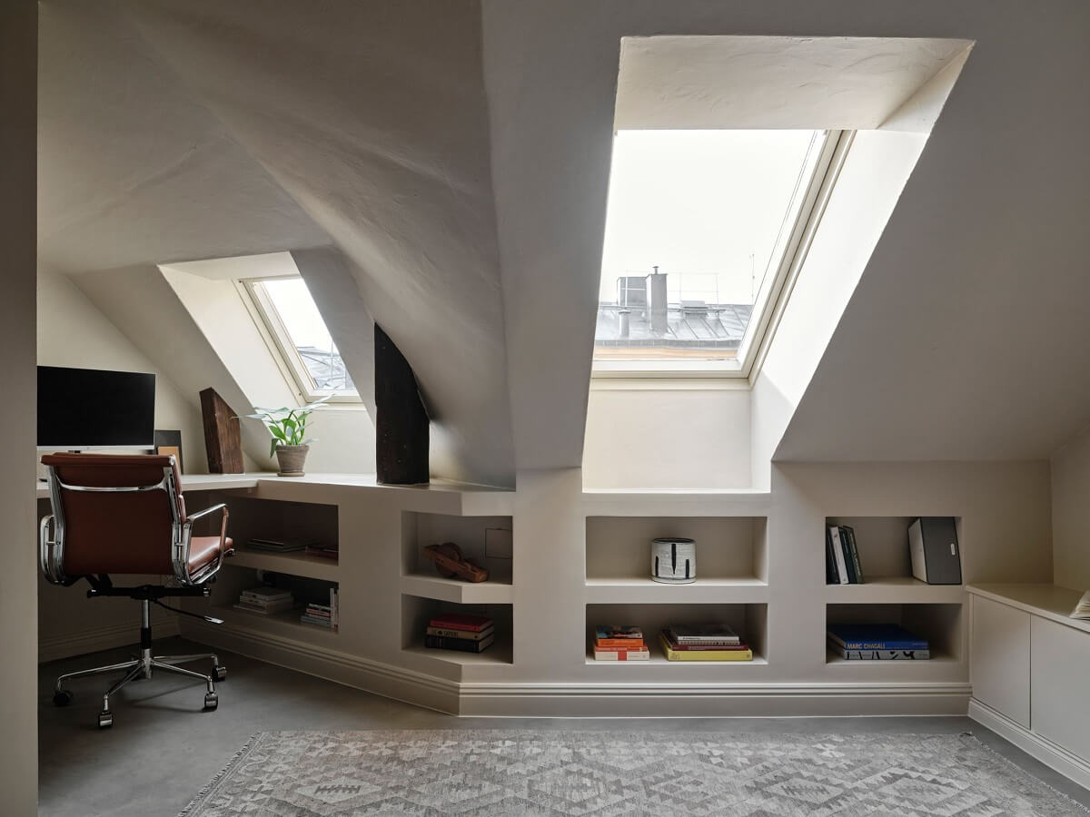 A Nordic Maisonette That Makes The Most Of Its Awkward Nooks 15 attic-room-sloped-ceiling-home-office-built-in-shelves-nordroom