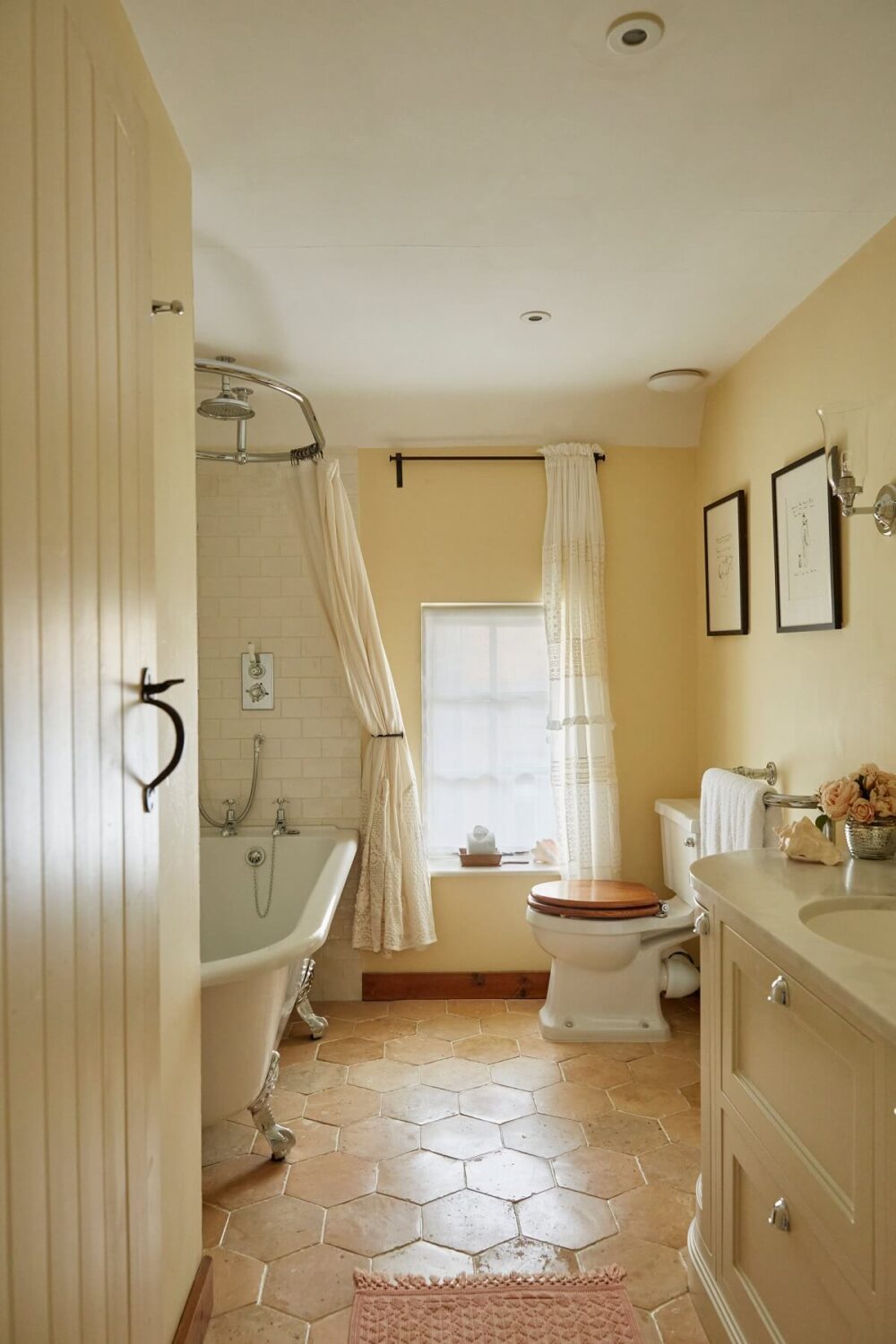 A Charming Arts and Crafts Cottage in the English Countryside 12 bathroom-clawfoot-bath-pale-pink-walls-hexagon-floor-tiles-nordrom