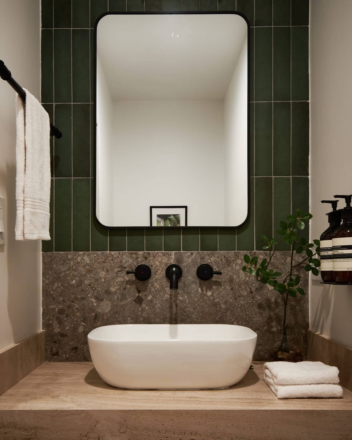 A Stylish Los Angeles Bungalow Renovated by a Designer 9 bathroom-green-vertical-tiles-nordroom
