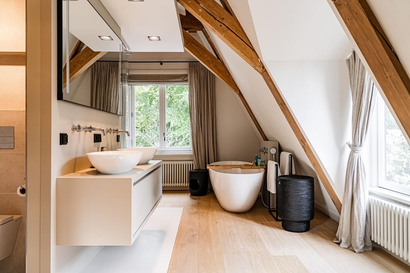 A Luxurious Dutch Villa in a Former Carriage House 21 bathroom-sloped-ceiling-wooden-beams-freestanding-bath-nordroom