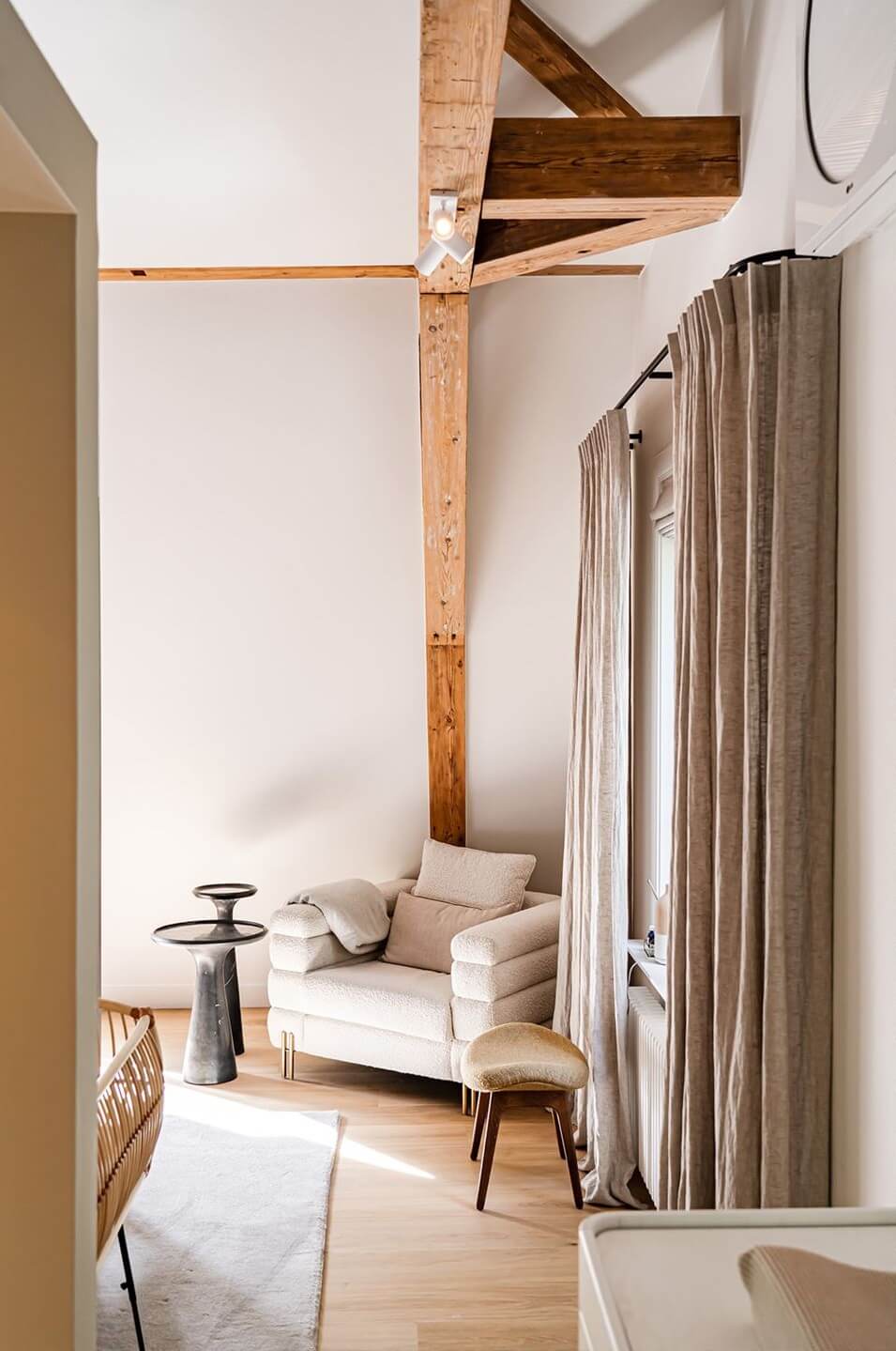 A Luxurious Dutch Villa in a Former Carriage House 20 bedroom-lounge-chair-wooden-beams-nordroom
