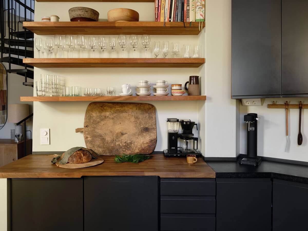 A Nordic Maisonette That Makes The Most Of Its Awkward Nooks 9 black-kitchen-open-shelves-nordroom